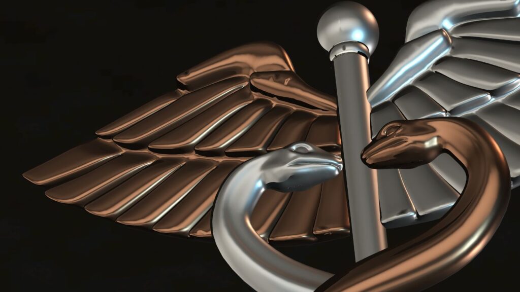 starożytny symbol Hermesa Trismegistosa, np. kaduceusz